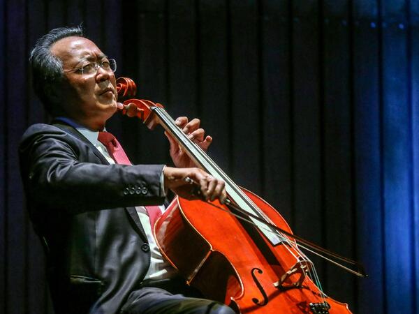 (FILES) In this file photo French-born Chinese-American cellist Yo-Yo Ma plays during a concert at the Metropolitan Theater in Medellin, Antioquia department, Colombia on May 9, 2019. - Receiving a second Covid vaccine dose is often a cause for celebration and, in one US clinic, legendary cellist Yo-Yo Ma marked the occasion with a surprise recital. Ma was pictured playing the cello while wearing a mask and sitting on a plastic chair at the Berkshire Community College in Massachusetts during his 15-minute observation period after getting the jab on March 13, 2021. (Photo by JOAQUIN SARMIENTO / AFP)