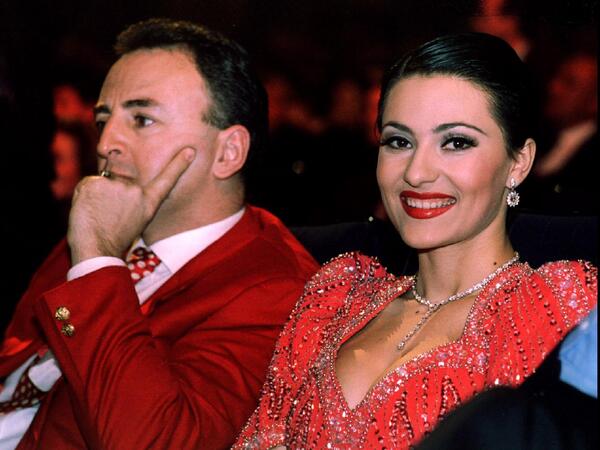 Serbian paramilitary leader Zeljko Raznatovic-Arkan and wife Ceca , Yugoslav turbo-folk music star , watch ceremony marking the 50th anniversary of the Red Star sports club in Belgrade March 4. The newly-wed couple draw masses of onlookers wherever they go
ArkanCeca26